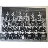MANCHESTER UTD B/W 16 x 12 photo, Man Utd players posing for a squad photo prior to the 1973/74
