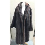 A Canadian musquash fur coat, with makers label fo