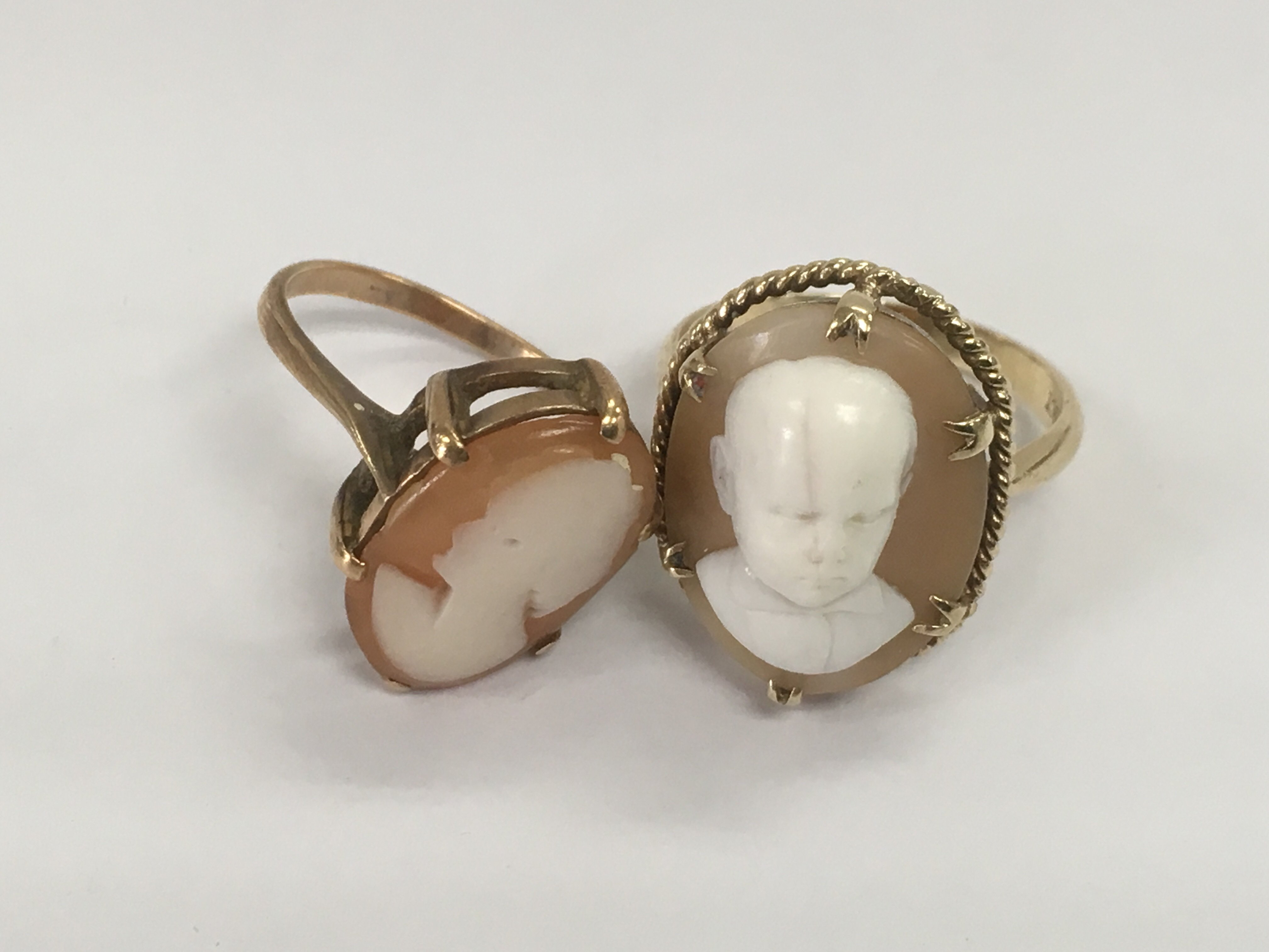 Two Cameo rings, one marked 9ct, approx 9g.