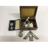 A small box containing a Masonic silver gilt medal