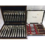Two cased silver plated cutlery sets.