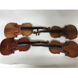 A box containing a collection of 5 antique violins