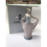 A boxed Lladro figure of a young lady.