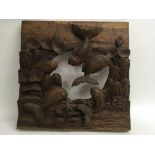 A hardwood frame or plaque carved with fish.Approx