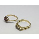 Two 18ct gold stone set rings, a red cluster and a