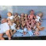 A box of plastic baby dolls , all different sizes