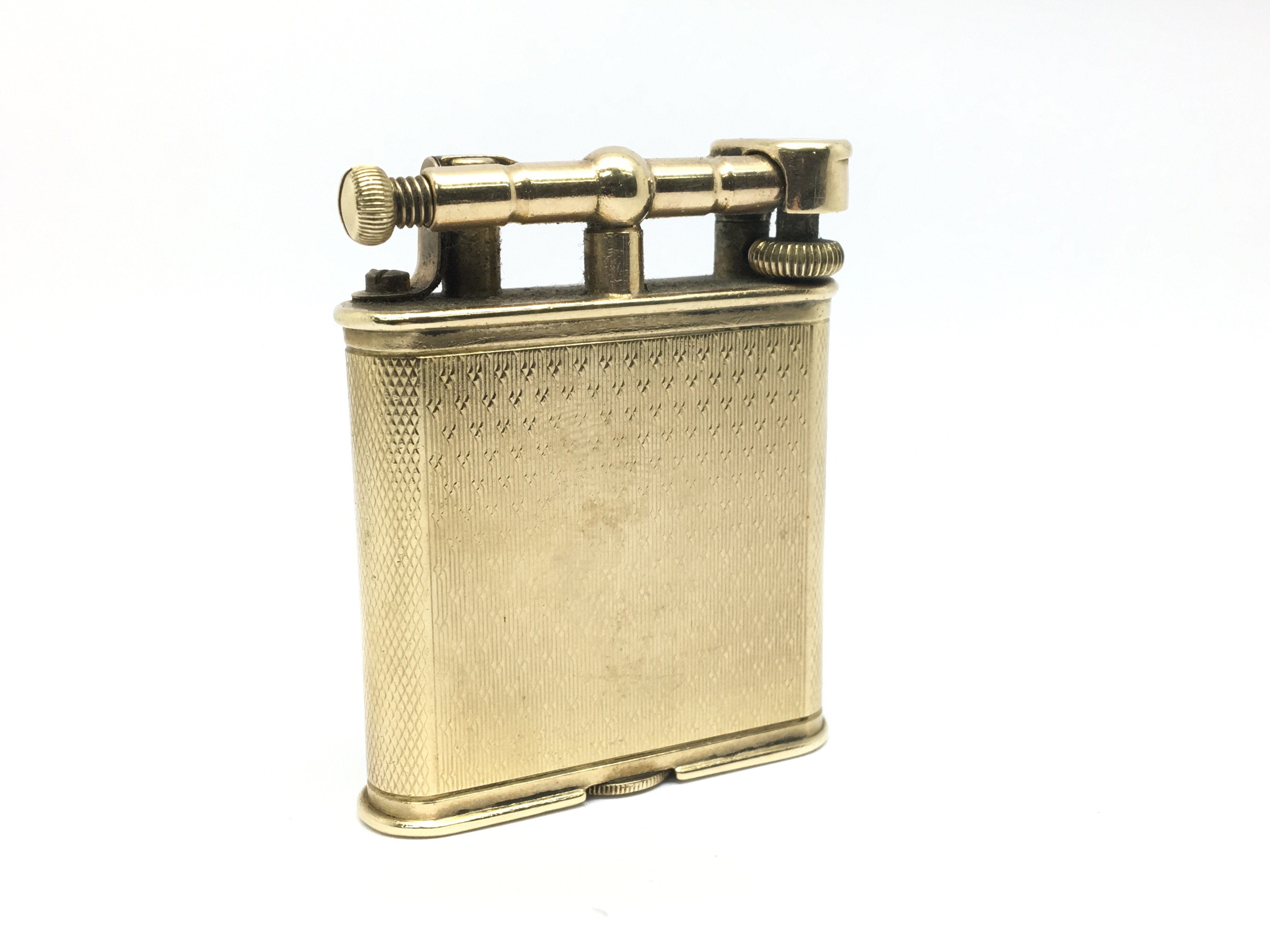 A vintage 9ct gold Dunhill lighter.