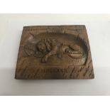 A small Victorian walnut carved plaque inscribed H