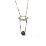 A 9ct gold necklace with a drop blue stone. Total