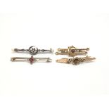 Four vintage gold bar brooches, all set with stone