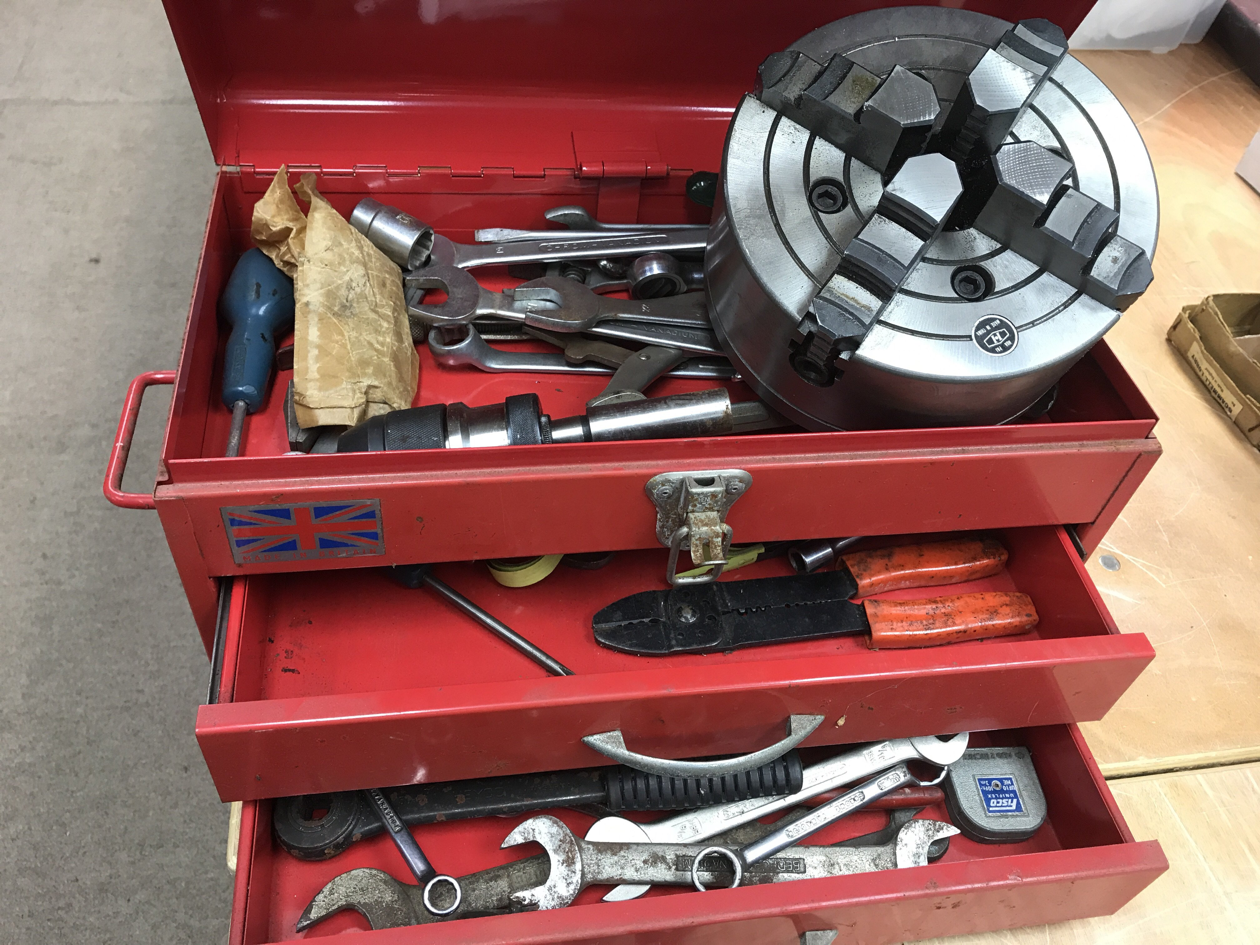 A red two draw tool box contains britool ratchet a