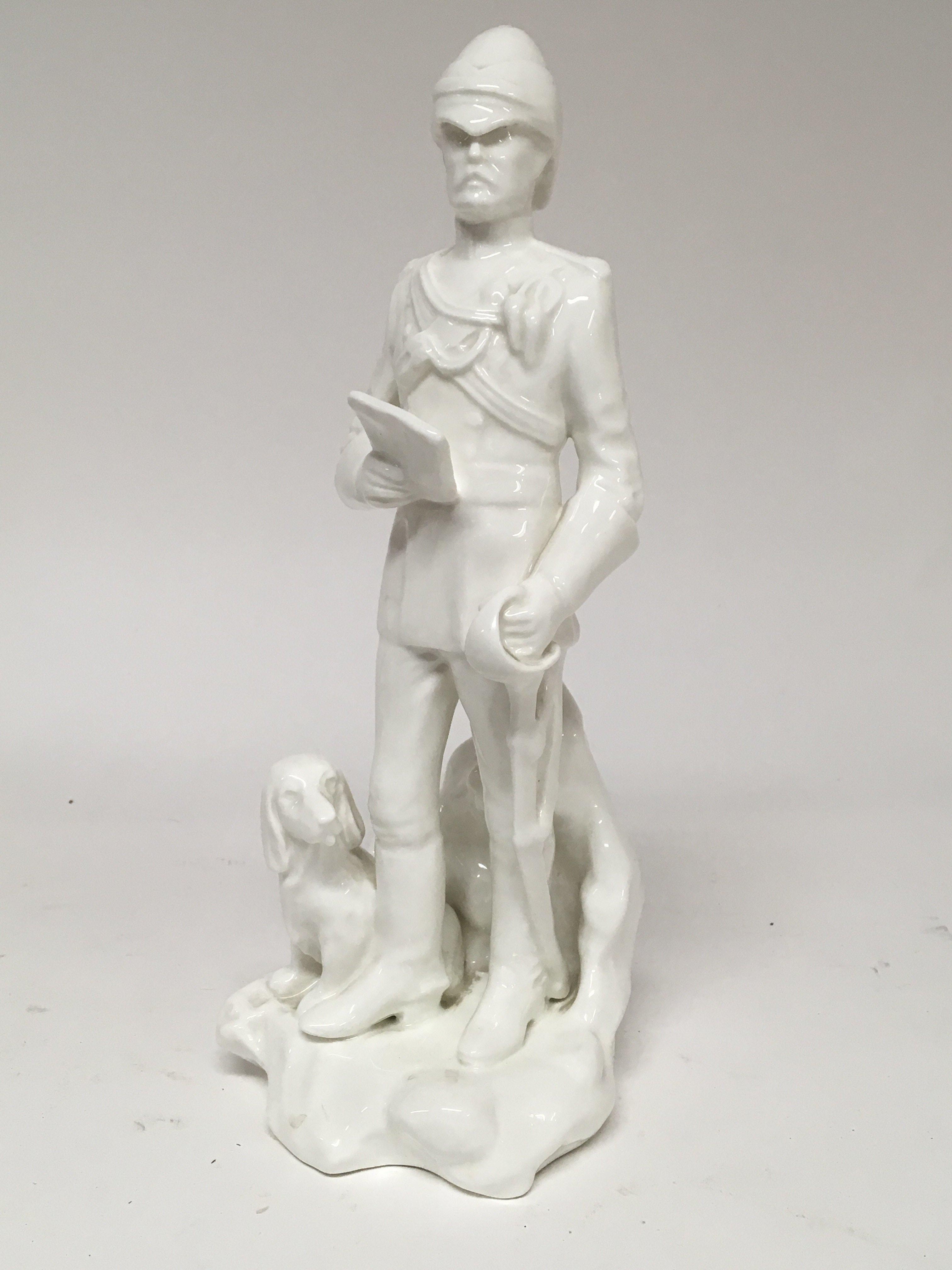 A Michael Sutty white glazed ceramics figure in th