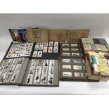 A collection of cigarette cards, loose and in albu