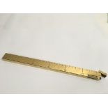 A Dunhill brass ruler lighter, 30cm