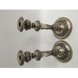 A large pair of silver plated candlesticks with fo