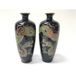 A pair of Chinese vases decorated with colourful d