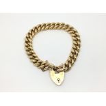 A ladies 15ct gold bracelet with heart shaped padl
