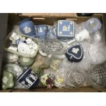 A box containing Wedgwood china and some crystal i