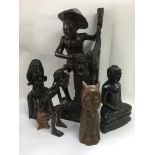 A collection of African carved wooden ornaments.