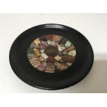 A Victorian black slate dish with a polished miner