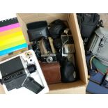 A box of cameras and accessories plus a boxed Pola