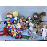 A box of dolls including knitted dolls and plastic