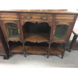 An Edwardian sideboard with single drawer glazed d