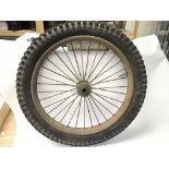 A pair of vintage wheels, likely for a motorbike,