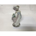 A Lladro figure in the form of a Art Deco style ma