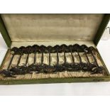 A cased set of 12 knive rests