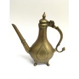 A brass pear shape Mughal ewer of flattened form h
