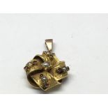 A Gothic revival gold pendant drop of woven style,