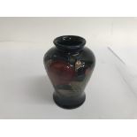 A small moorcroft vase decorated with pomegranate