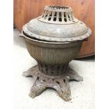 An unusual large cast iron heater.