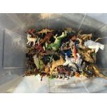 A box of plastic wild , domestic animals and Dinos
