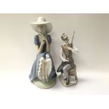 A Neo figure of a lady alongside a Lladro figure o