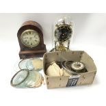A box of watch and clock spare parts and glass.