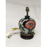 A Moorcroft lamp decorated with wild Poppy’s on a