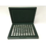 A case containing 100 miniature ingots depicting t