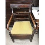 A late George III commode chair.