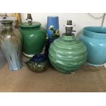 A collection of pottery comprising two table lamps two vase a jardiniere and a dresser style tea