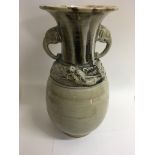 A Chinese celadon pottery drip glazed vase the twi