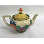 A Clarice cliff tea pot decorated in the gay day pattern , no damage or paint loss