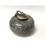 A small unusual inkwell in the form of a curling s