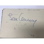 A vintage autograph book containing the signatures