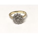 An 18carat gold diamond cluster ring ring size O.