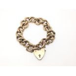 A 9ct gold chain link bracelet with heart shaped p