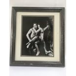 A framed and glazed publicity photograph of Johnny