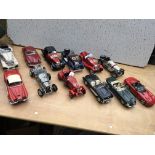 A collection of 1:18 scale diecast model vehicles