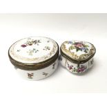 A circular antique enamelled box decorated to the
